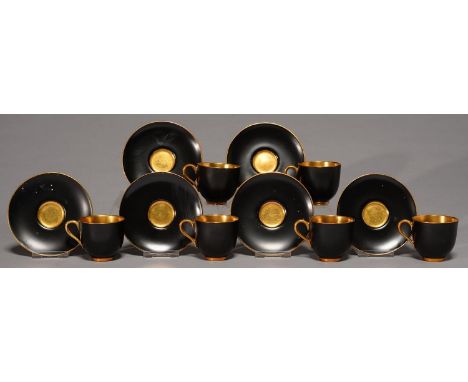A SET OF SIX ROYAL WORCESTER BLACK GROUND CUPS AND SAUCERS, 1936, WITH GILT CENTRE, INTERIOR AND HANDLE, SAUCER 98MM, PRINTED