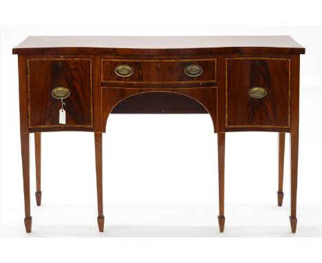 AN EDWARDIAN&nbsp;SERPENTINE MAHOGANY SIDEBOARD, C1910, CROSSBANDED IN SATINWOOD AND LINE INLAID, ON SIX SQUARE TAPERED LEGS 