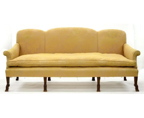 A VICTORIAN MAHOGANY SOFA, C1900, IN GEORGE II STYLE, ON EIGHT MOULDED SQUARE LEGS CARVED WITH HUSK PENDANTS AND TERMINATING 