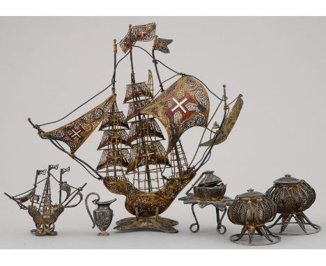 A SPANISH GILT SILVER COLOURED FILIGREE AND ENAMEL MODEL OF A SHIP AND FIVE SIMILAR SMALLER ARTICLES, SECOND HALF 20TH C, SHI