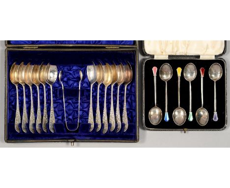 A SET OF TWELVE EDWARDIAN SILVER COFFEE SPOONS AND PAIR OF SUGAR BOWS, ENGRAVED WITH FLOWERS, INITIALLED R, BY HAMILTON, LAID