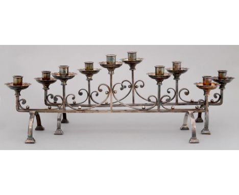 A PAIR OF ARTS &amp; CRAFTS EPNS CANDELABRA, C1930, OF FIVE LIGHTS LINKED BY C SCROLLS ON ARCHED LEGS, 24CM H, ONE INSCRIBED 