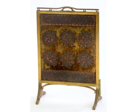 AN EDWARDIAN GILTWOOD FIRE SCREEN, C1910, WITH EARLIER GOLD-VELVET GROUND METAL THREAD APPLIQUE BANNER, 85CM H; 54CM W Old re