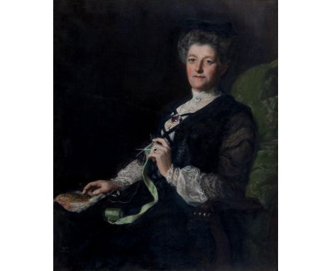 THE HON. JOHN COLLIER, OBE (1850-1934) - PORTRAIT OF A LADY KNITTING SEATED IN A GREEN ARMCHAIR, SIGNED (IN RED), OIL ON CANV