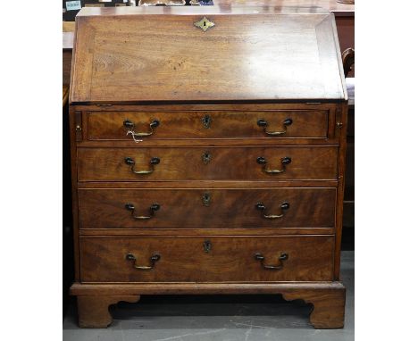 A GEORGE III MAHOGANY BUREAU, C1800, WITH FITTED INTERIOR ABOVE FOUR DRAWERS, ON BRACKET FEET, 108CM H; 91 X 53CM Top faded, 