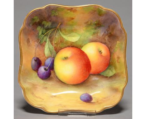 A ROYAL WORCESTER SHAPED SQUARE DISH, 1935, PAINTED A SHUCK, SIGNED, WITH AN ALL OVER STILL LIFE WITH FRUIT BEFORE A MOSSY BA