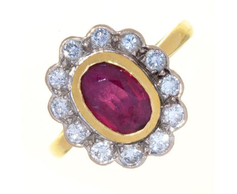 A RUBY AND DIAMOND CLUSTER RING, IN 18CT GOLD, LONDON 1996, 5.1G,&nbsp; SIZE N Good condition