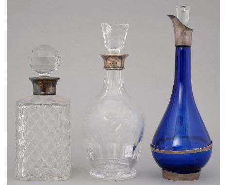 AN ELIZABETH II SILVER&nbsp; MOUNTED BLUE GLASS DECANTER AND STOPPER, 32CM H, MAKER VRL, 2002 AND A PAIR OF SILVER MOUNTED GL