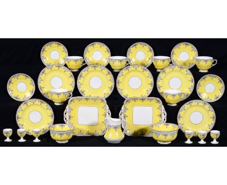 A GEORGE JONES YELLOW GROUND CRESCENT CHINA THE HONITON BREAKFAST SET, SECOND QUARTER 20TH C THE SERVICE INCLUDING TWO SQUARE