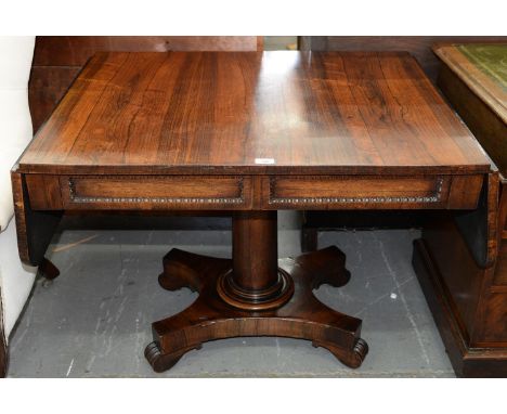 A GEORGE IV ROSEWOOD SOFA TABLE, C1830, THE TOP FITTED WITH TWO DRAWERS AND OPPOSING BLIND DRAWERS, ON PLAIN TAPERING PILLAR,