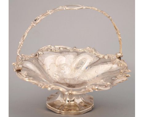 A VICTORIAN SILVER CAKE BASKET, OF SPIRALLY LOBED FORM,&nbsp; CHASED AND APPLIED WITH C SCROLLS AND FOLIAGE, THE PIERCED HAND