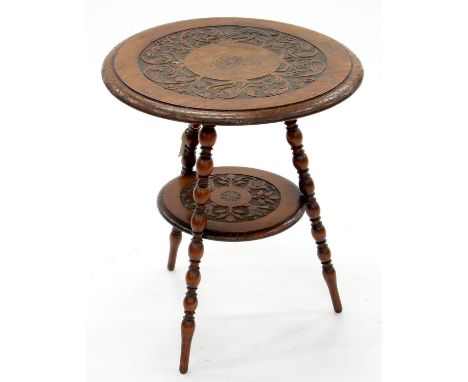 AN EDWARDIAN CARVED WALNUT OCCASIONAL TABLE, C1900, WITH ROUND TOP AND UNDERTIER, ON THREE BOBBIN TURNED LEGS, 54CM H; 47CM D