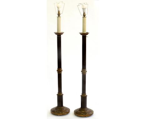 A PAIR OF 'ANTIQUE' AND BLACK PATINATED BRASS ALTAR CANDLESTICK FORM STANDARD LAMPS, 20TH C, 125CM H EXCLUDING FITMENTS Some 
