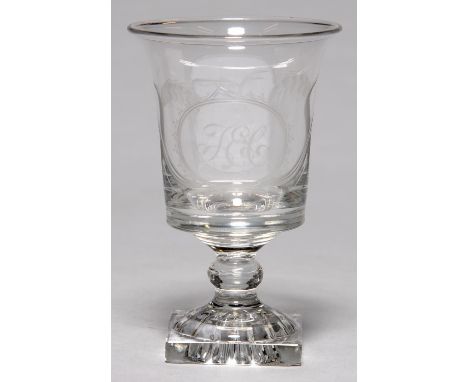 AN ENGLISH GLASS RUMMER, C1800, THE FLARED BUCKET SHAPED BOWL ENGRAVED WITH INITIALS T E C IN AN OVAL MEDALLION SURMOUNTED BY