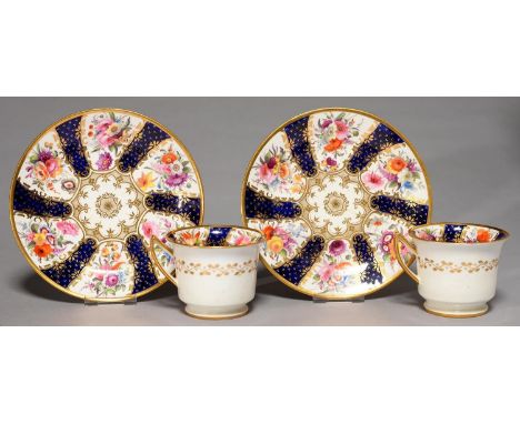 A PAIR OF DAVENPORT COBALT GROUND ETRUSCAN COFFEE CUPS AND SAUCERS, C1825, PAINTED WITH FLORAL RESERVES AND RICHLY GILT, SAUC