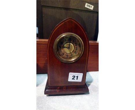 A small Edwardian mahogany mantle clock