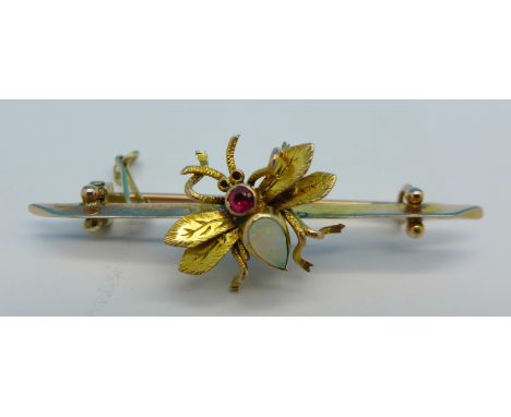 A 9ct gold insect brooch set with opal and ruby, 2.4g