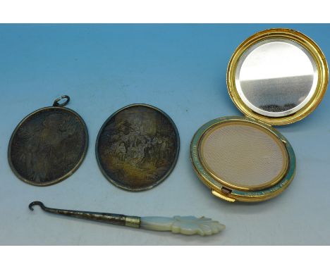 Two white metal oval plaques with engravings of famous paintings, after Greuze and Teniers, an Elizabeth Arden compact and mo
