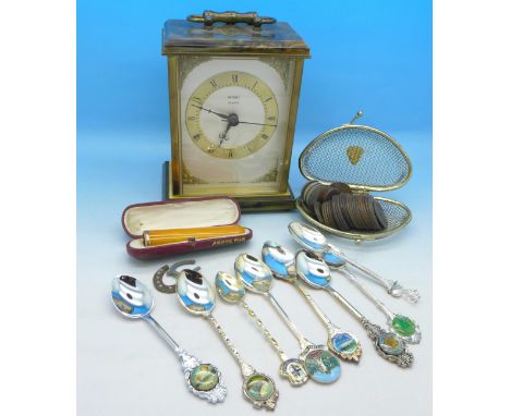 A Metamec quartz mantel clock, British coins, mainly pennies, an amber cheroot holder with gold rim, a wire purse and plated 