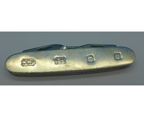 A silver penknife with Rodgers steel blade and tools