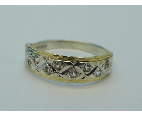 A 9ct gold, silver and white stone half eternity ring, M