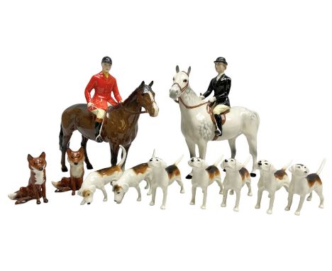 Beswick hunting group, comprising huntswoman on grey horse no 1730, huntsman on brown horse no 1501, two seated fox figures n