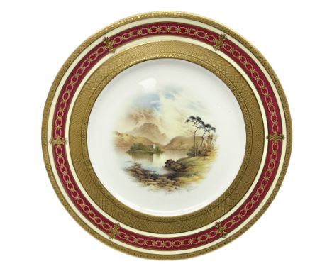 Early 20th century Coalport cabinet plate, the central reserve finely hand painted with a landscape scene of Kilchurn Castle 