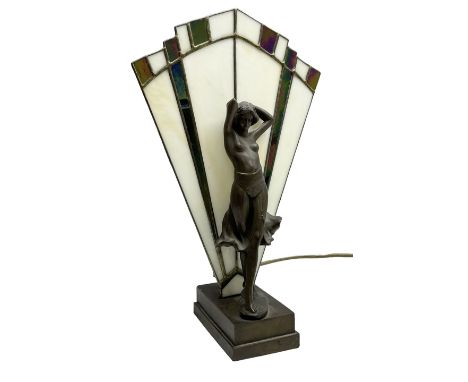 Art Deco style table lamp, modelled in the form of a bronzed female figure before a leaded glass fan shaped shade, H38cm