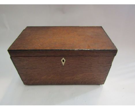 A Georgian oak tea caddy 