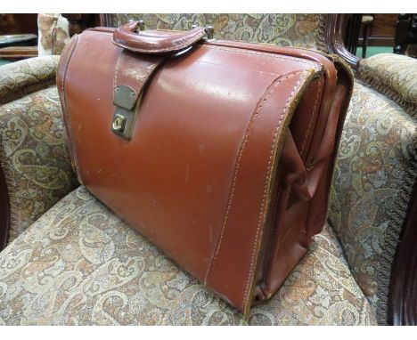 A vintage cow hide doctors bag 