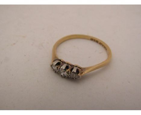 An 18ct gold diamond set ring. Size Q, 2.1g