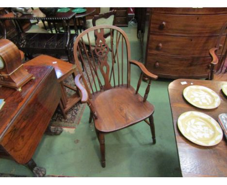 A pair of 19th Century wheel-back Windsor armchairs, the elm seats over ring-turned legs joined by an "H" stretcher