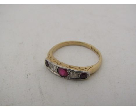 An 18ct gold Ruby and diamond ring. Size J/K, 2.9g