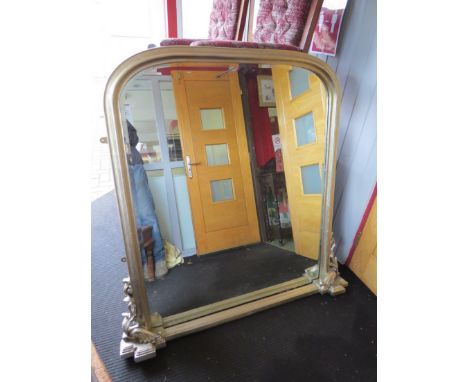 A silvered domed top over mantel mirror, 125cm wide x 136cm tall