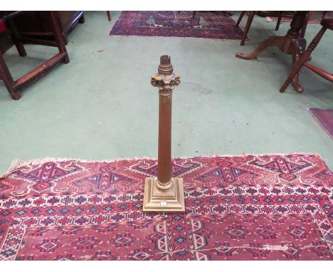 A brass Corinthian column form table lamp base, no lead
