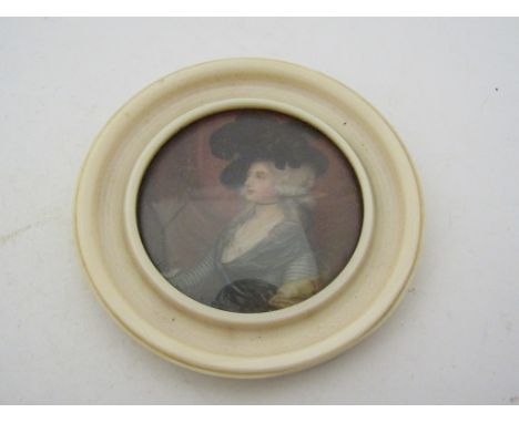 A Georgian portrait miniature of a woman Mrs Siddous 1755-1831. 4cm diameter 