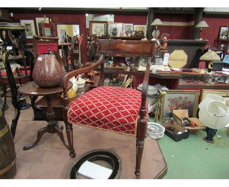 A circa 1820 mahogany armchair the scroll end arms on turned legs and later Victorian ceramic castors, 83cm high  