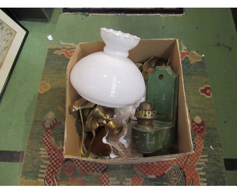 A box containing oil lamp chimney and shades and a selection of brassware, etc