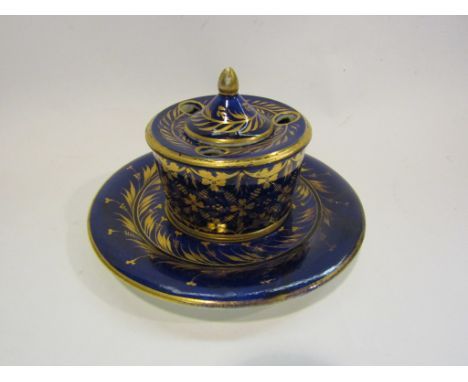 A Bloor Derby gros bleu and gilt inkwell and lid.  A similar 19th Century Derby saucer/stand.  (painted marks in iron red) (2