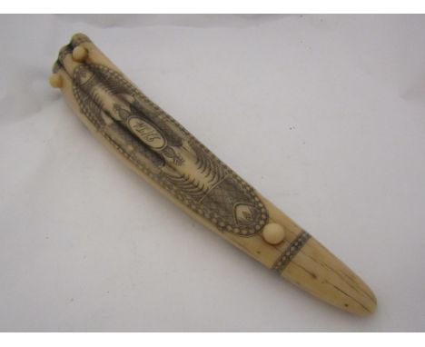 A reproduction scrimshaw cribbage board