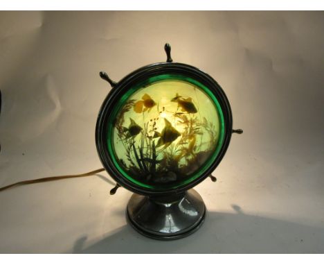 A retro lamp with fish scene in the shape of a ships wheel