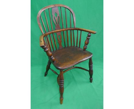Early comb back elm seated armchair with crinoline stretcher 