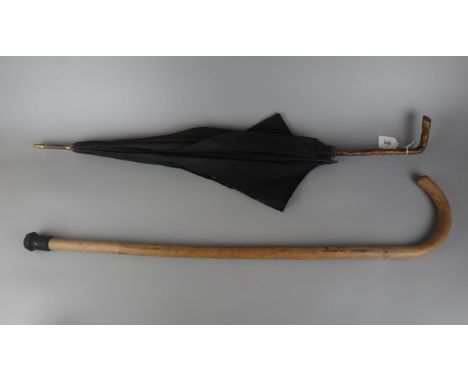 Antique parasol together with a walking stick 