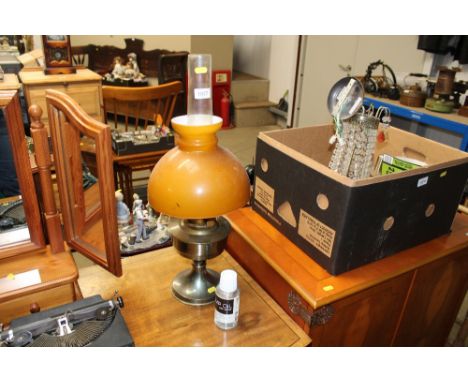 An oil lamp with a container of lamp oil