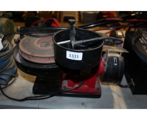 A Seeley dry and wet combination bench grinder 