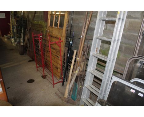 A quantity of long handled gardening tools