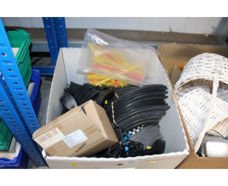 A box containing Scalextric track