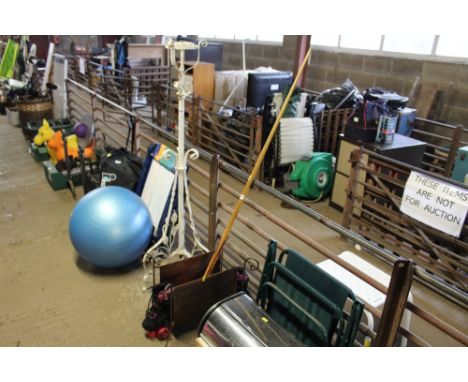 A pool cue, a pair of as new roller skates and a magazine stand