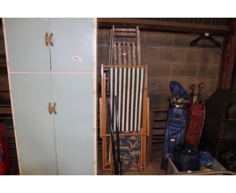 A deck chair; a folding step ladder and a curtain rail