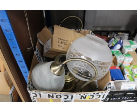 A box containing an oil lamp and table lamps